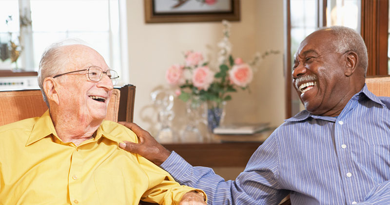 Senior men relaxing in armchairs